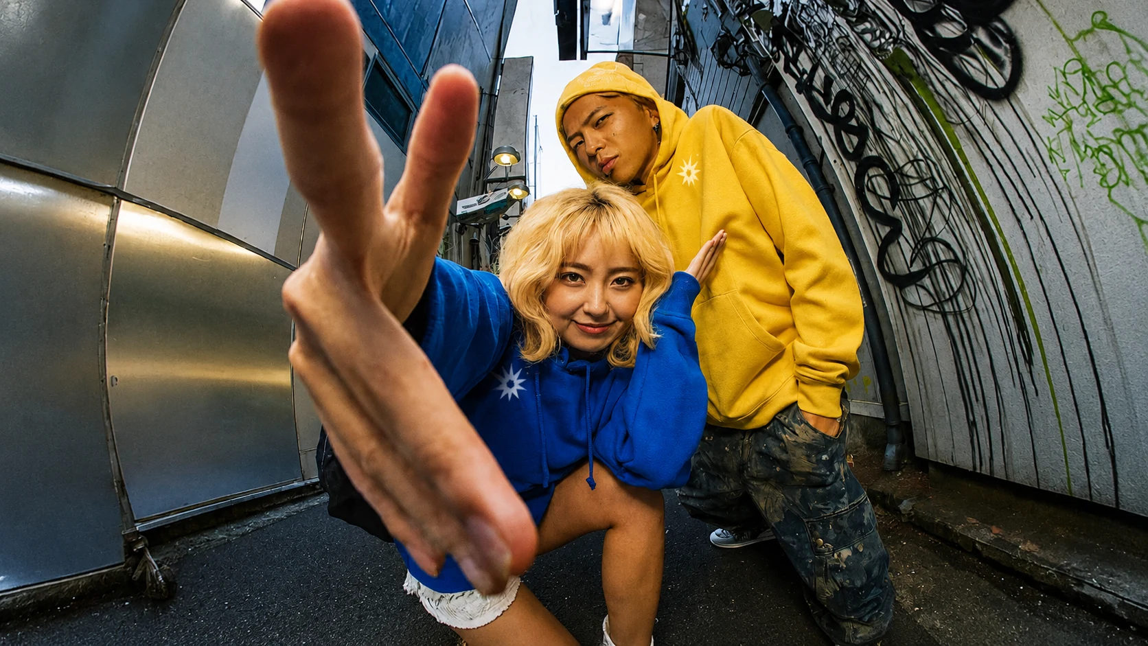 BLAZE duo campaign portrait in an alley