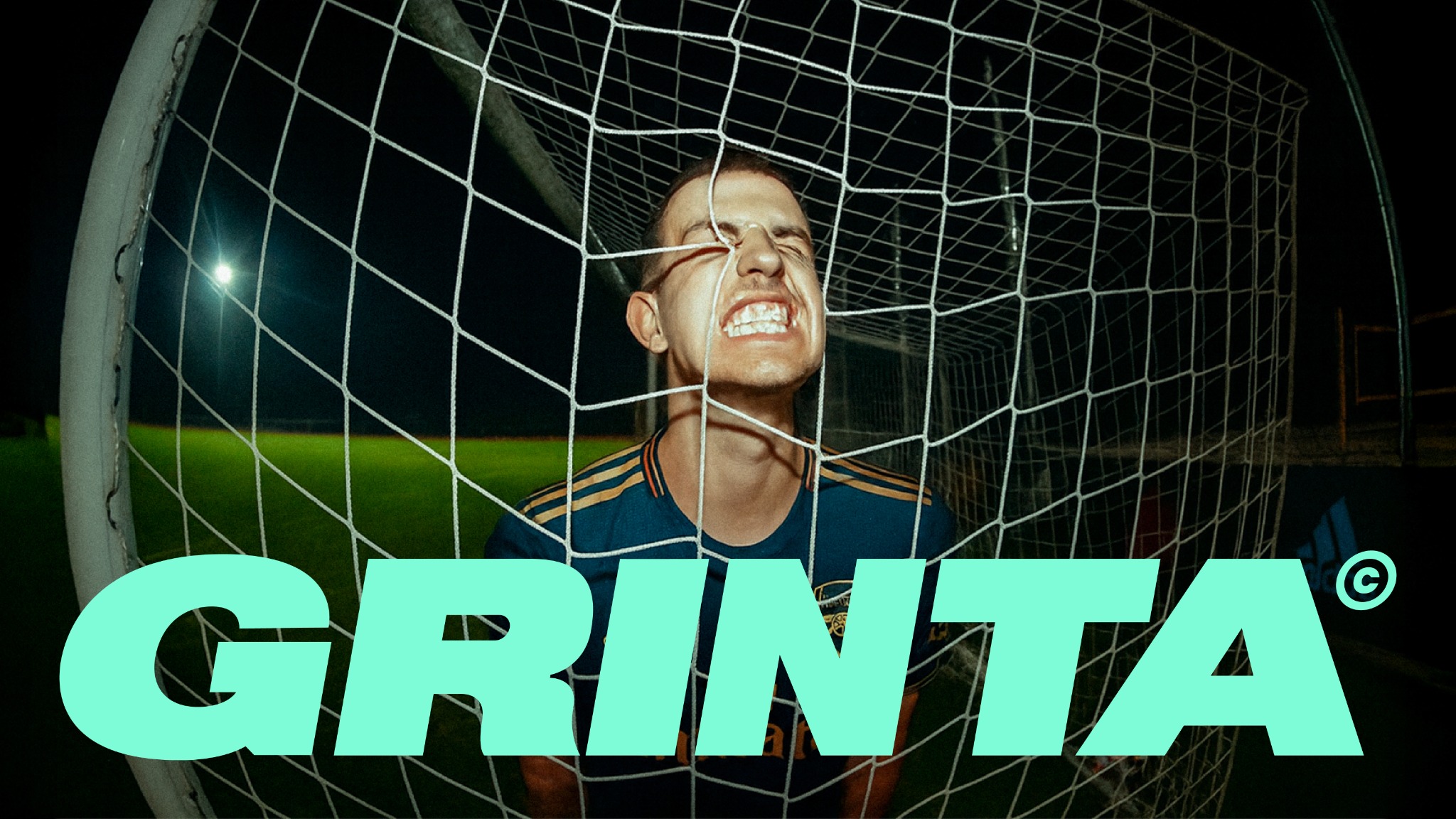 GRINTA player against goal net